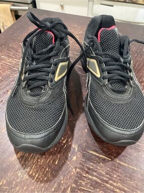 Reebok Black Athletic Sneakers with Gold Accents and Pink Trim